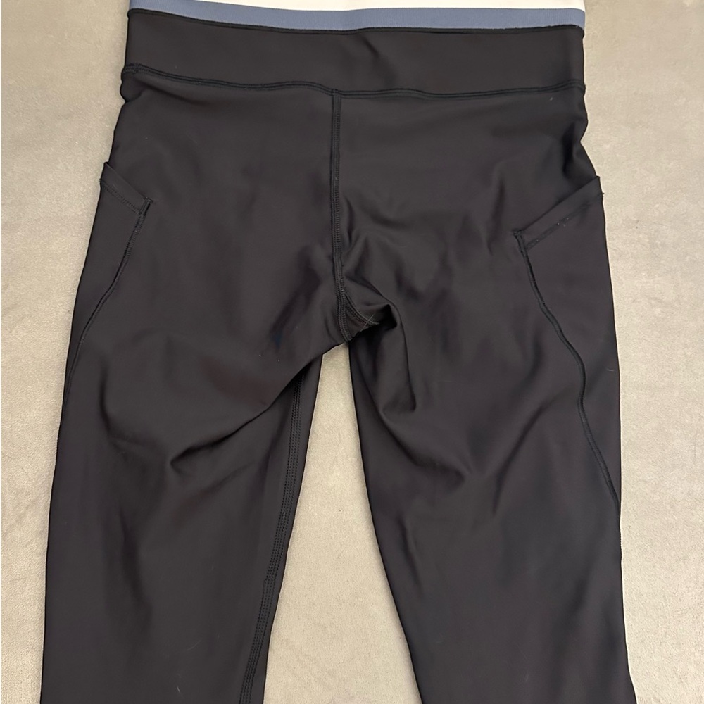 Athleta interval stash pocket high rise legging with piping color